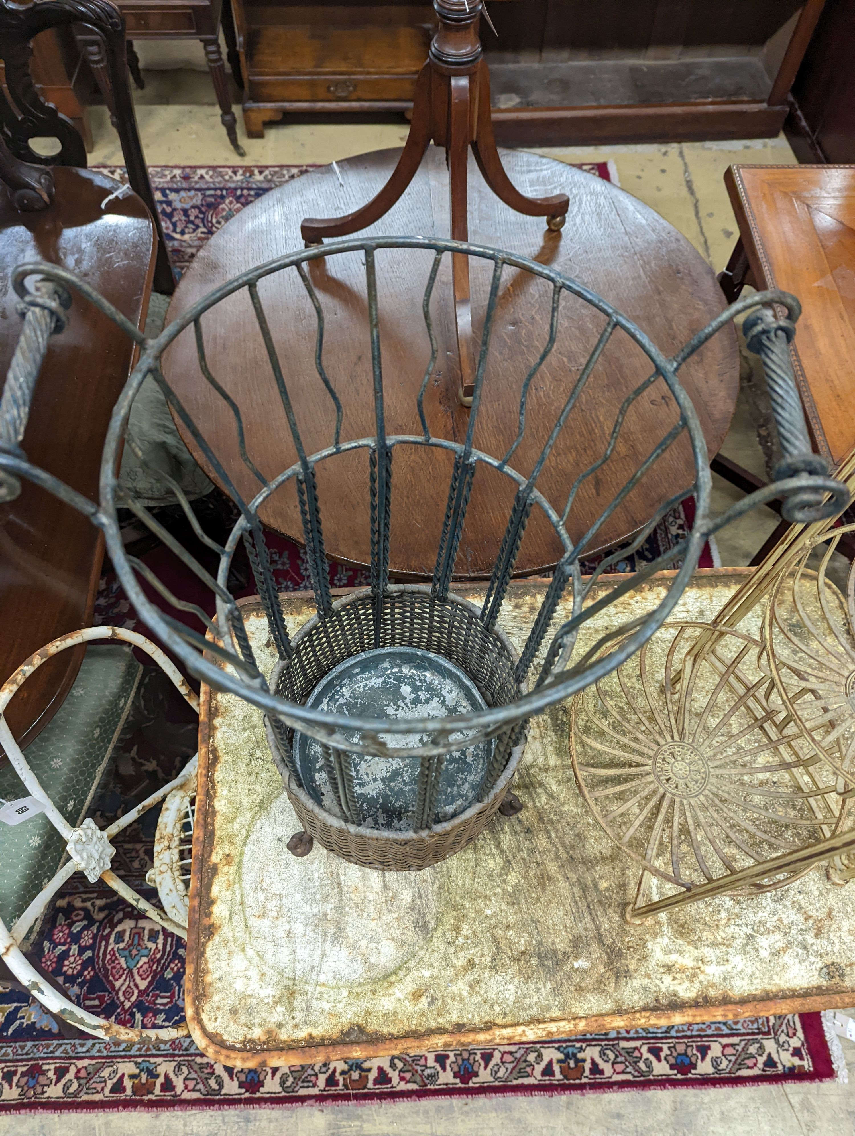 A rattan and wirework stick stand, height 63cm, together with one other folding stand